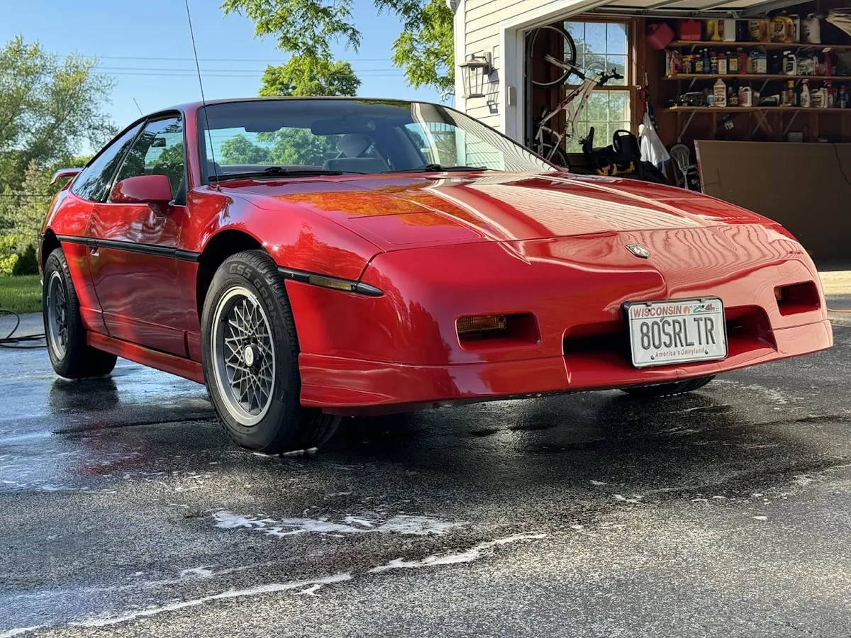 Red Pontiac Fiero GT gleaming after a full mobile detail by Armour Detailing