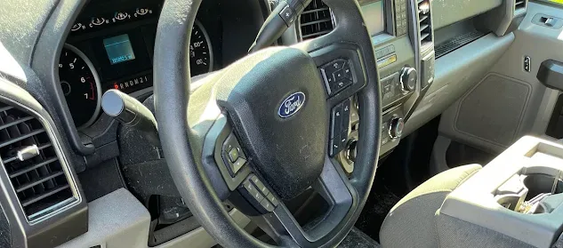 Dirty F-150 interior before mobile detailing in Lima OH